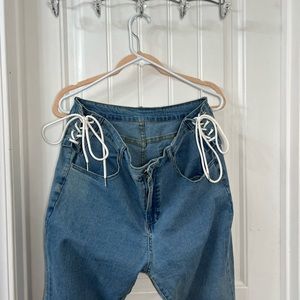 SHEIN medium wash denim flare jeans with lace up detail on hips